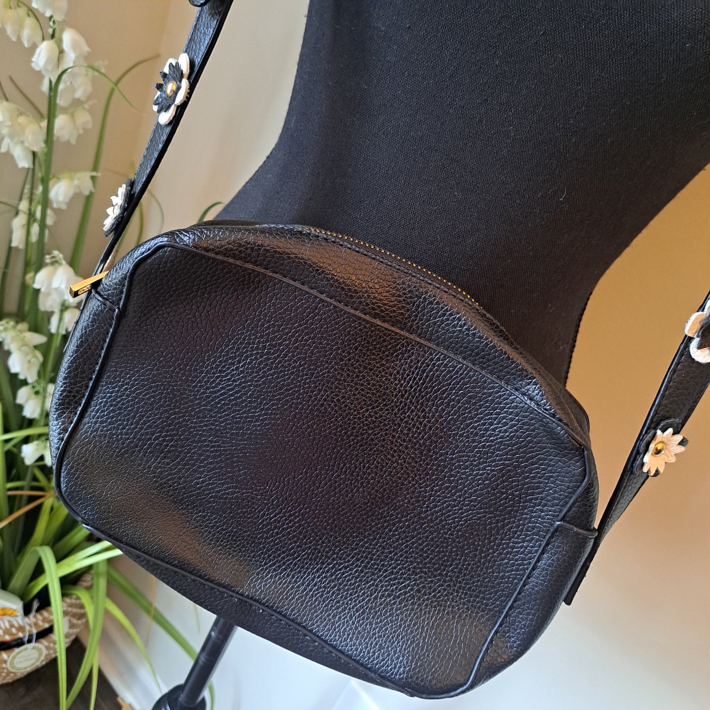 IMO Black faux leather crossbody with flowers on shoulder strap