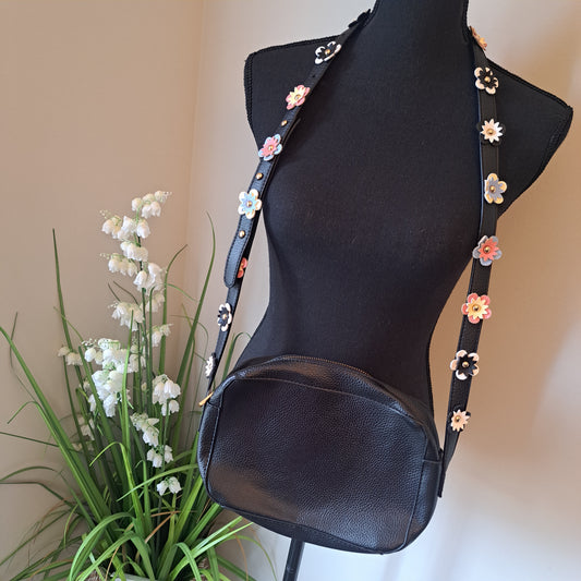 IMO Black faux leather crossbody with flowers on shoulder strap