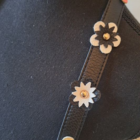 IMO Black faux leather crossbody with flowers on shoulder strap